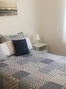 Postel nebo postele na pokoji v ubytování APARTAMENTO S´ERMITA