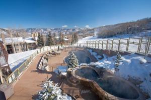 a hot tub in a snow covered ski slope at Timberline Condominums Studio Loft Standard Unit 301 in Snowmass Village