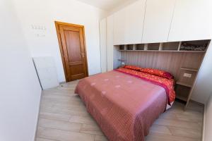 Ένα ή περισσότερα κρεβάτια σε δωμάτιο στο Il Nido