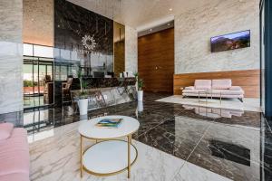 a living room with a table and a couch at Soho Magic Lux in Bar
