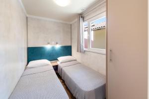 A bed or beds in a room at Camping Village Episkopos