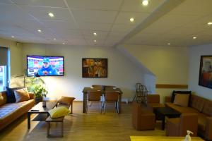 Телевізор і / або розважальний центр в Pizza House Bed Simrishamn