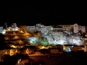 a view of a city at night with lights at Appartamenti Attilio in Tropea