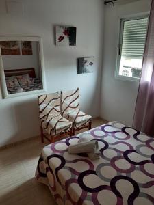 Postel nebo postele na pokoji v ubytování 1ª Linea Playa Deluxe Costa Marina