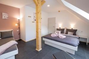 Postel nebo postele na pokoji v ubytování Pr `Agotnik Apartments & Rooms Bohinj