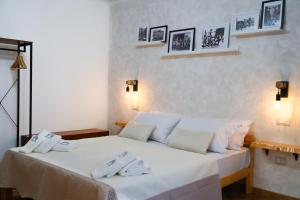 Giường trong phòng chung tại FamiliaINN Rooms & Apartments