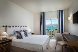 A bed or beds in a room at Hotel Villa Margherita