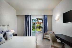 A bed or beds in a room at Hotel Villa Margherita