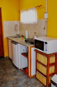 Una cocina o kitchenette en La Aldea