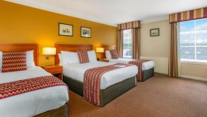 Krevet ili kreveti u jedinici u okviru objekta Eviston House Hotel