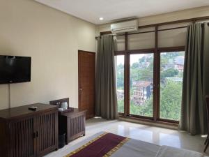 TV o dispositivi per l'intrattenimento presso Dago Highland Resort