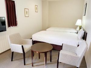 Postel nebo postele na pokoji v ubytování Smile Hotel Kitaasaka