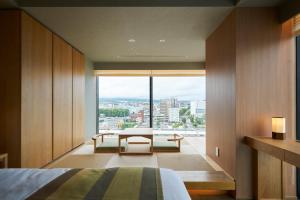 Giường trong phòng chung tại Fujisan Mishima Tokyu Hotel
