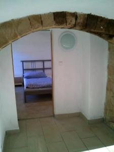 a view of a bedroom with a bed in a room at Roubenka Ruzova in Růžová