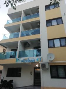 a building with a motorcycle parked in front of it at Studio Turquoise - Eforie Nord in Eforie Nord