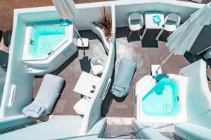 an overhead view of a bathroom and a tub at Eternity Suites Santorini in Fira