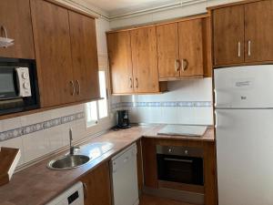 Kuchyň nebo kuchyňský kout v ubytování ApartamentoS Rosa + 10 fotografií