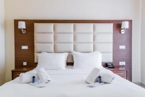 Postel nebo postele na pokoji v ubytování Thalassa Apart Hotel