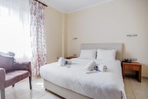 Postel nebo postele na pokoji v ubytování Thalassa Apart Hotel