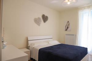 Postel nebo postele na pokoji v ubytování A casa di Carlotta vista mare