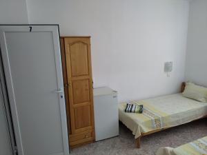 Postel nebo postele na pokoji v ubytování Къща за гости Давидови