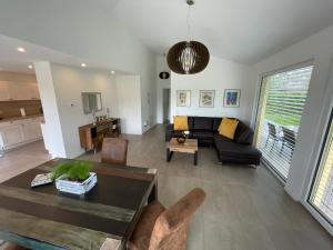 a living room with a couch and a table at FEWO Sunshine in Villingen-Schwenningen