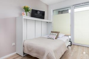 Posteľ alebo postele v izbe v ubytovaní Kasprowicza 20 Uzdrowisko by Jantar Apartamenty Kołobrzeg