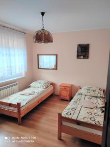 Lova arba lovos apgyvendinimo įstaigoje Apartament Bieszczady