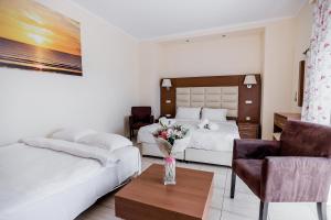 Postel nebo postele na pokoji v ubytování Thalassa Apart Hotel