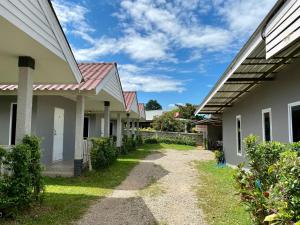 a row of houses with a pathway between them at Huen Vasana Chiang Dao in Chiang Dao