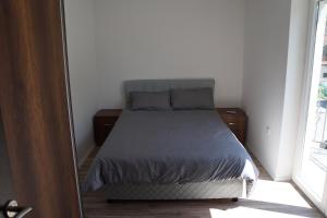 Ένα ή περισσότερα κρεβάτια σε δωμάτιο στο Lux Apartman Bogosavljevic