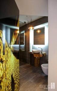 a bathroom with a sink and a toilet at Ali Baba Apartment in Mostar