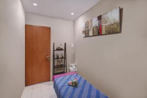 Ένα ή περισσότερα κρεβάτια σε δωμάτιο στο Quest Hotel Darmo - Surabaya by ASTON