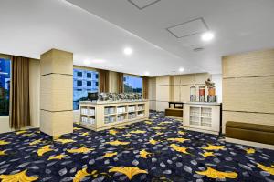 Ένα ή περισσότερα κρεβάτια σε δωμάτιο στο Quest Hotel Darmo - Surabaya by ASTON