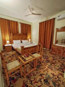 Ein Bett oder Betten in einem Zimmer der Unterkunft Duroyou Inn