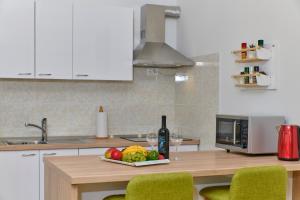 Kuchyň nebo kuchyňský kout v ubytování Apartment Olivix