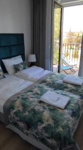 Ένα ή περισσότερα κρεβάτια σε δωμάτιο στο Apartament Kameleon