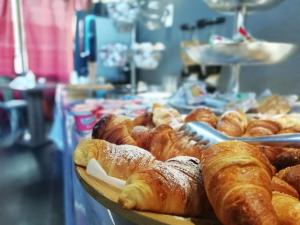 a bunch of pastries on a table in a bakery at Hotel Sereno in Sestri Levante
