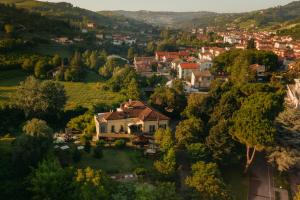 an aerial view of a house in a village at Hotel Langhe in Alba