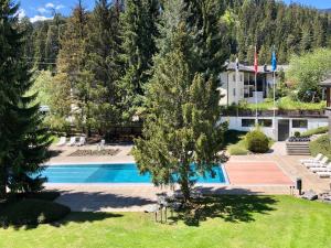 an aerial view of a resort with a swimming pool at Rancho Laaxdeluxe in Laax