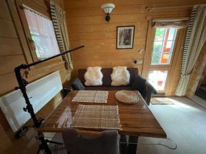 a living room with a table and a couch at Ferienhaus " Uns Hüsung" in Rerik