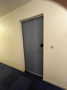 a door in the corner of a room at studio la grande roue VUE MAGNIFIQUE in Cap d'Agde +41 photos