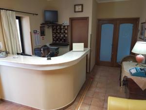 TV a/nebo společenská místnost v ubytování Hotel Il Vulcano