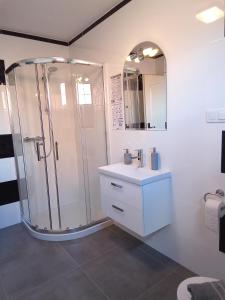 a bathroom with a shower and a sink at Zajazd Marco Torzym in Torzym