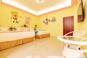Ένα ή περισσότερα κρεβάτια σε δωμάτιο στο Mu Yu B&B