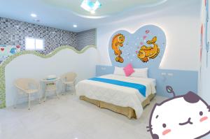 Ένα ή περισσότερα κρεβάτια σε δωμάτιο στο Mu Yu B&B