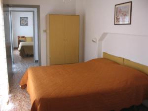 Postel nebo postele na pokoji v ubytování Hotel Eleonora