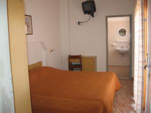 Postel nebo postele na pokoji v ubytování Hotel Eleonora