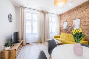 Televízia a/alebo spoločenská miestnosť v ubytovaní Modern Apartments Toruń 1 Stare Miasto-Centrum