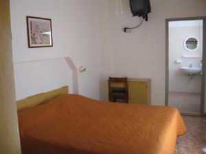 Postel nebo postele na pokoji v ubytování Hotel Eleonora